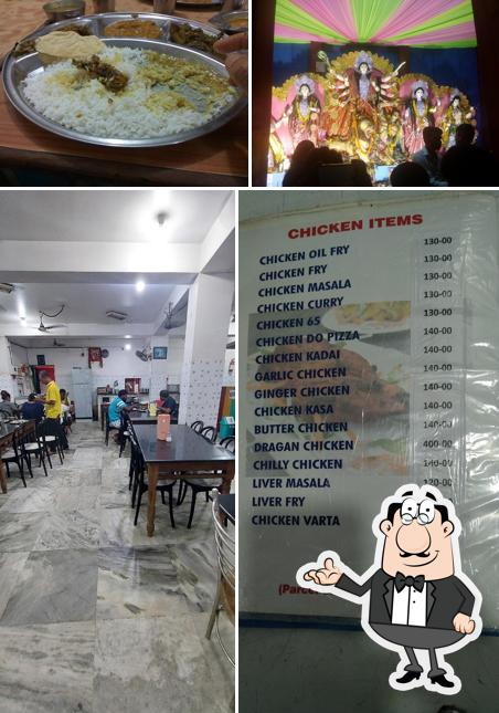 Take a seat at one of the tables at Adi Bengali Hotel