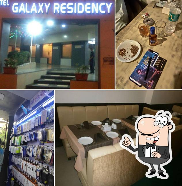 Take a seat at one of the tables at Galaxy Hotel