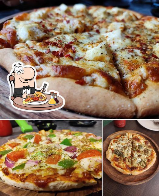 Try out pizza at MUMBAI MASALA