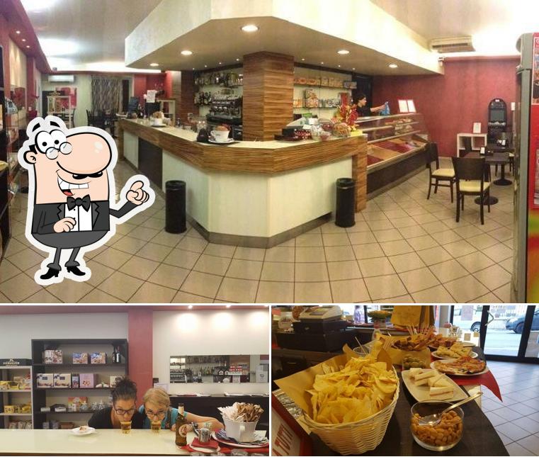 La foto della interni e pizza di Squisito Bar Ristorantino