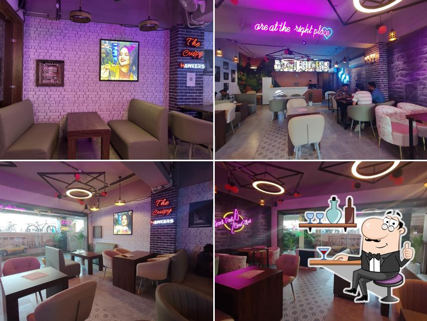 Take a seat at one of the tables at The Crispy Hawkers ( PPR Jalandhar )
