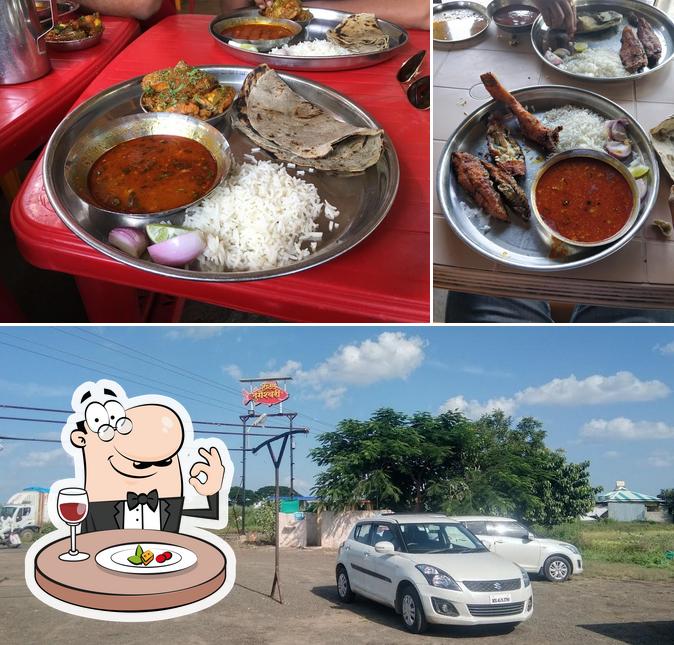 The photo of Hotel Durgeshwari’s food and exterior