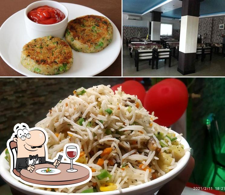 The photo of Atmaram Resturant’s food and dining table