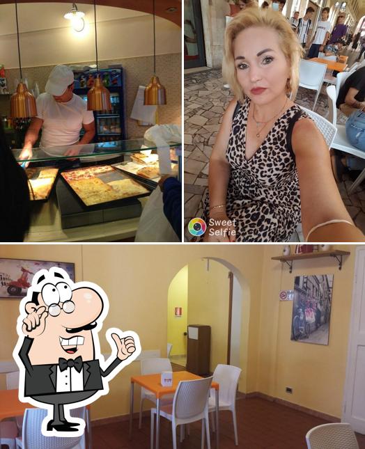 Dai un'occhiata agli interni di Pizzeria la dolce vita