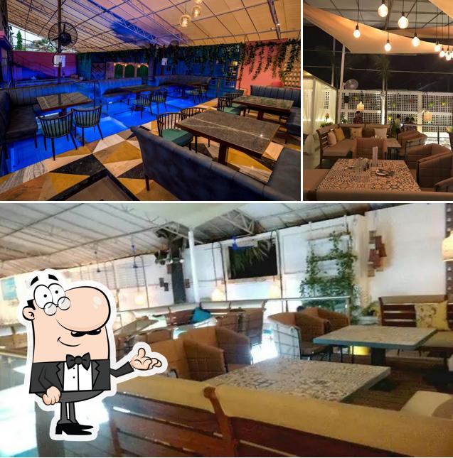 Take a seat at one of the tables at Amanzi Sky Deck and Bar