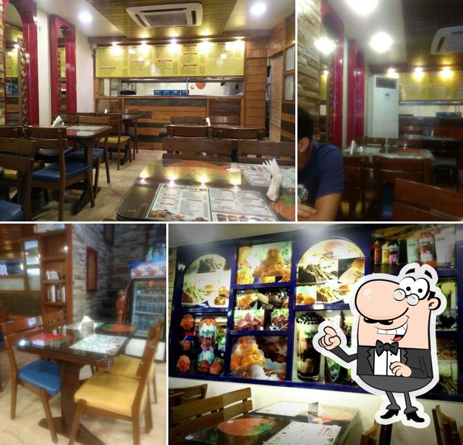 Take a seat at one of the tables at Bagicha Corner