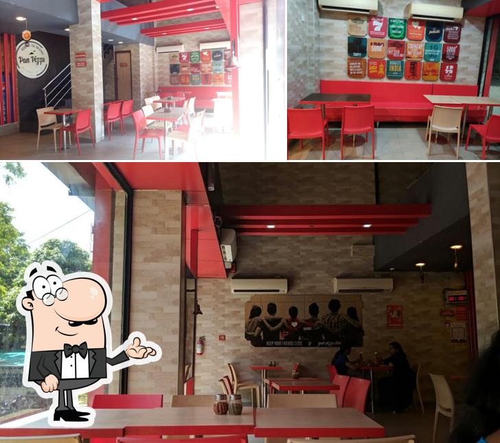 Take a seat at one of the tables at Pizza Hut Laxmi Nagar, Nagpur