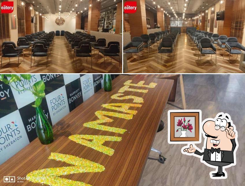 Take a seat at one of the tables at The Eatery - Four Points By Sheraton Chennai OMR