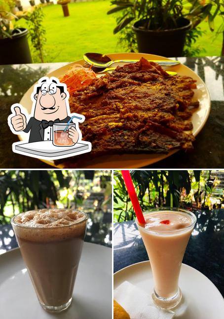 The picture of Garden View Restaurant’s drink and dining table