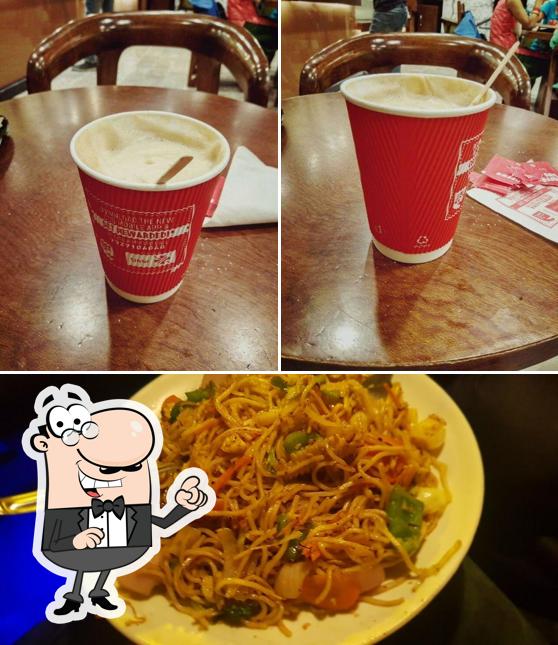 Take a look at the picture showing interior and food at Cafe Coffee Day