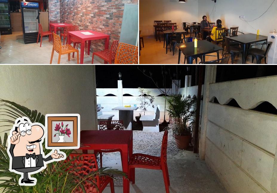 Take a seat at one of the tables at RESTO - 1987