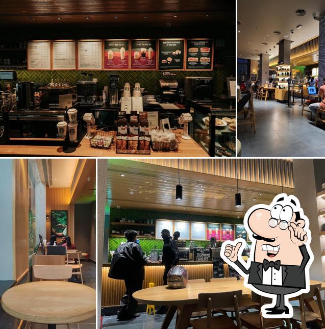 Take a seat at one of the tables at Starbucks Coffee