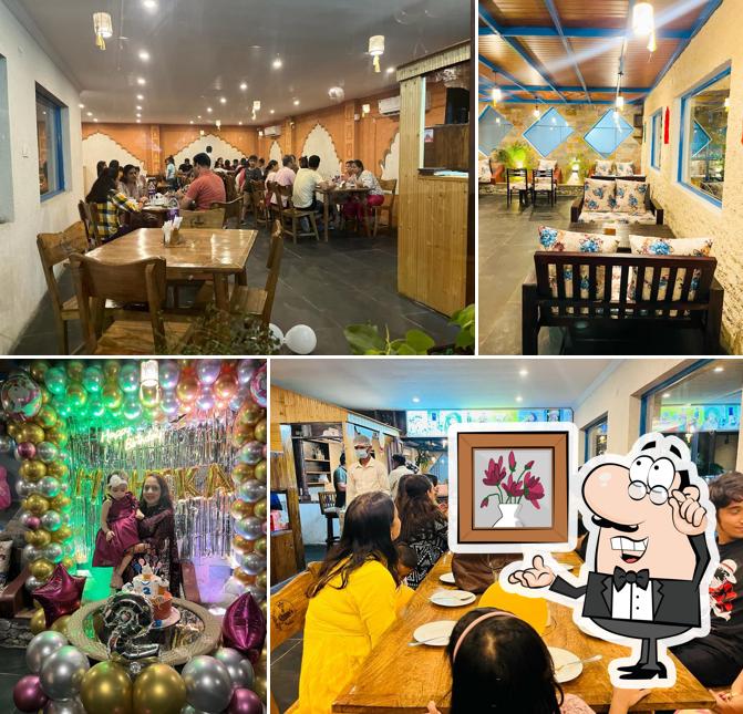 Take a seat at one of the tables at The Queen's Cafe Restaurant