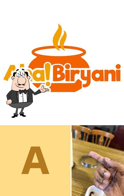 Take a seat at one of the tables at Aha! Biryani