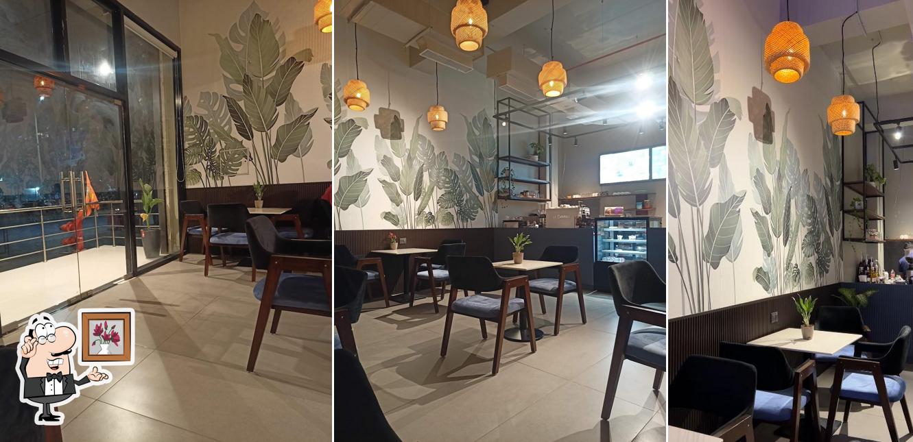 Take a seat at one of the tables at It's Street Coffee Lounge Wakad