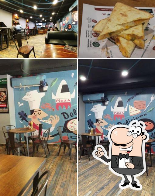 Take a seat at one of the tables at La Pino’z Pizza-Sri Ram Nagar Colony, Banjara Hills, Telangana