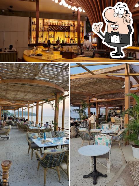 Take a seat at one of the tables at Kiki - By the sea