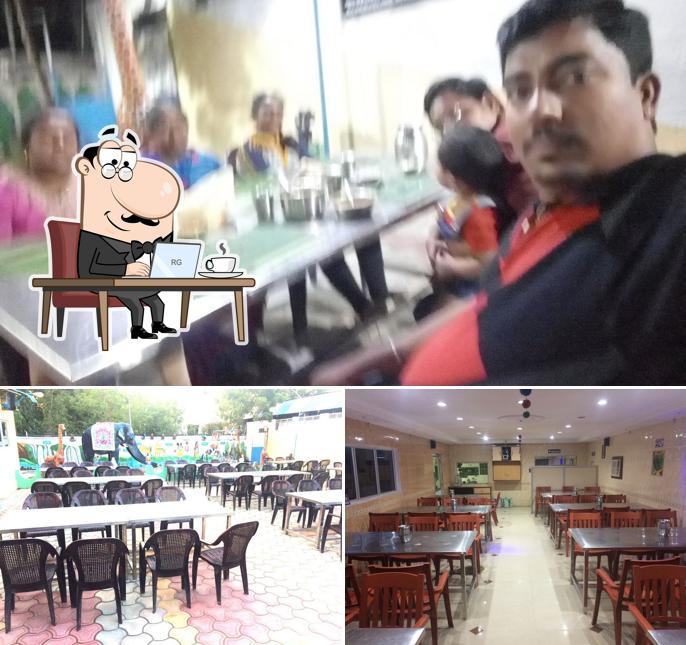 Take a seat at one of the tables at Vijayam Mess