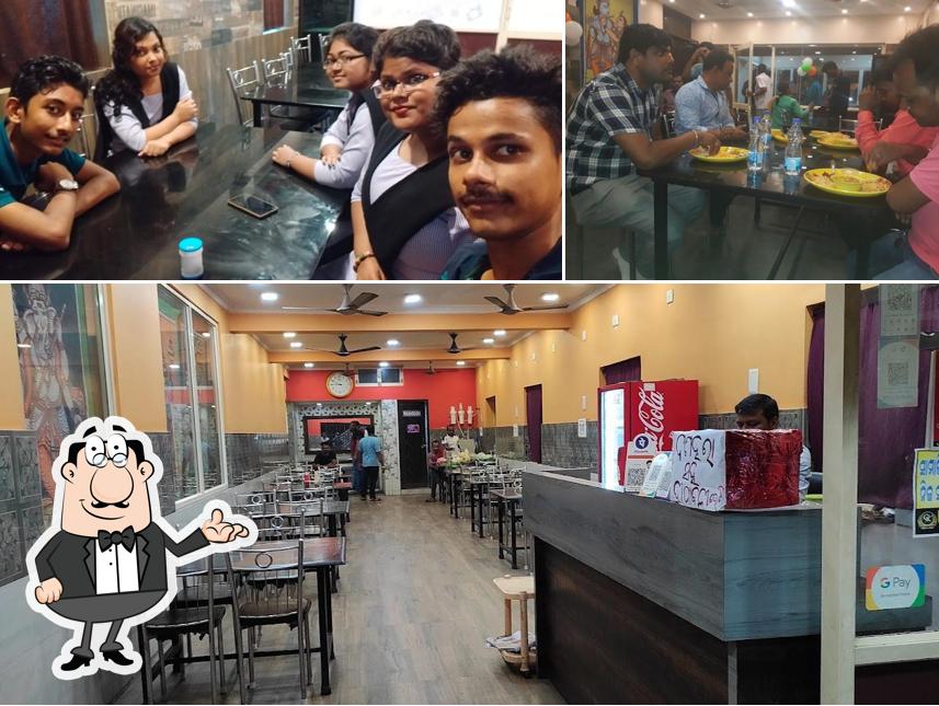 Among various things one can find interior and dining table at HOTEL GOLDEN KITCHEN