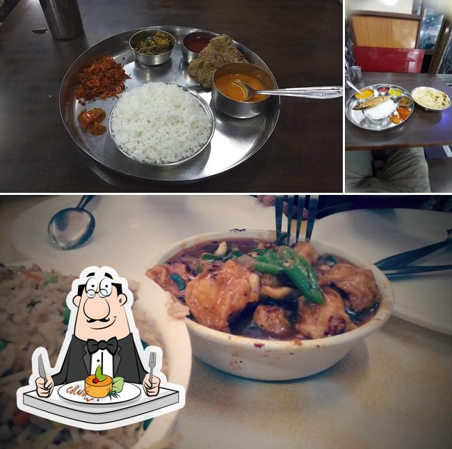 The photo of Adarsh Restaurant’s food and dining table
