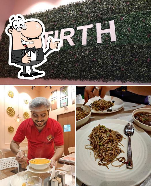 Look at this picture of Tirth Vegetarian & Jain Restaurant