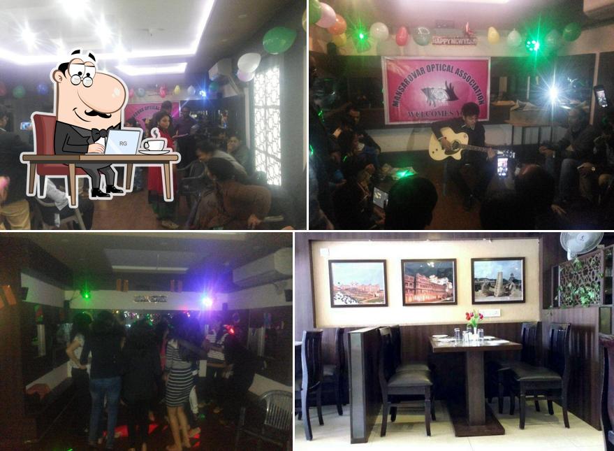 Take a seat at one of the tables at Jaipur Pride Restaurant