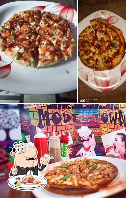 Get pizza at Model Town Restaurant