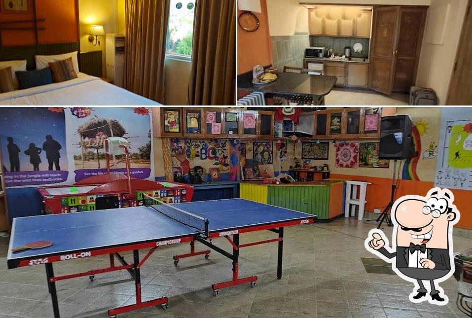 Take a seat at one of the tables at Bird Song- Club Mahindra Restaurant, Binsar, Uttarakhand