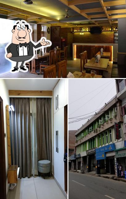 Take a seat at one of the tables at Mayur Hotel Bar & Restaurant