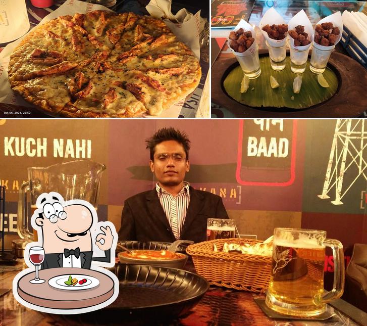 Check out the picture showing food and beer at Thikana Baner