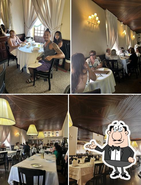Sente em uma das mesas no Restaurante Leite