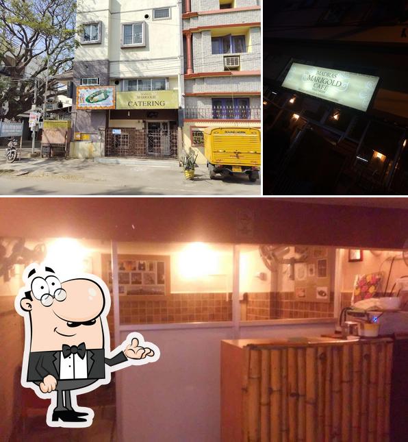 Take a seat at one of the tables at Madras Marigold Cafe