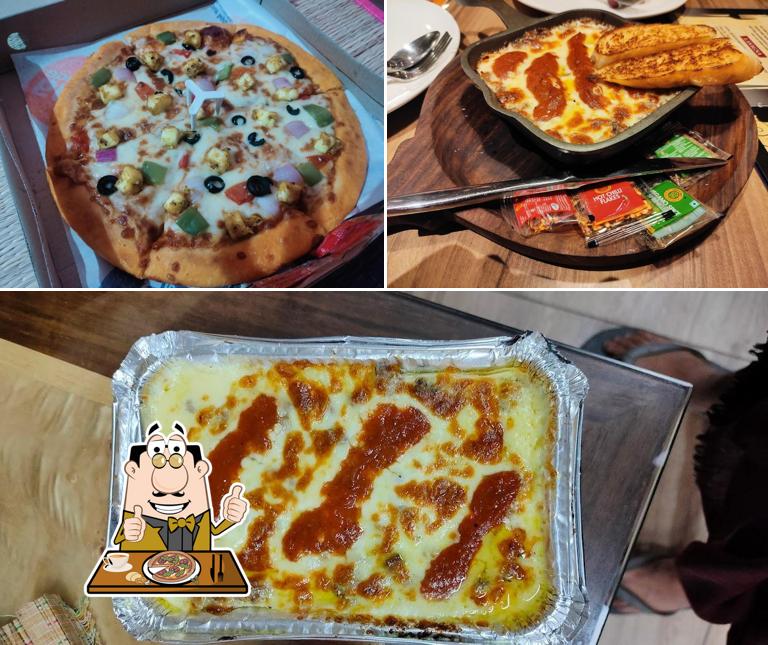 Try out pizza at Lekshmi edibles Gourmet Restaurant