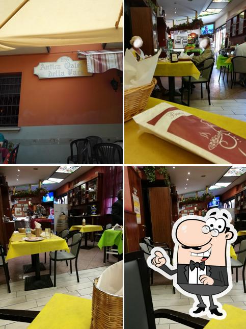 Dai un'occhiata agli interni di Antica Osteria Della Pace