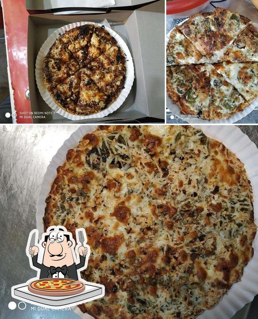 Get pizza at Pooja Station
