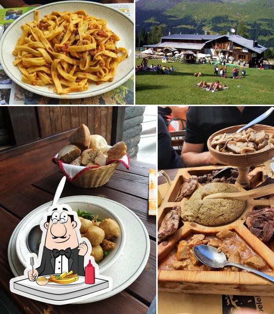 Assaggia un piatto di patatine a Albergo Rifugio Paradiso