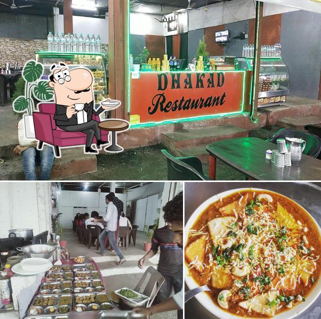 Take a seat at one of the tables at Dhakad Restaurent