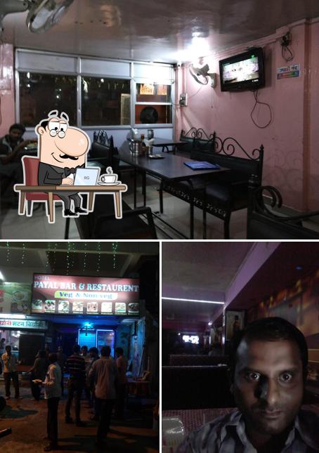 Take a seat at one of the tables at Payal Restaurant(Veg-Non Veg)