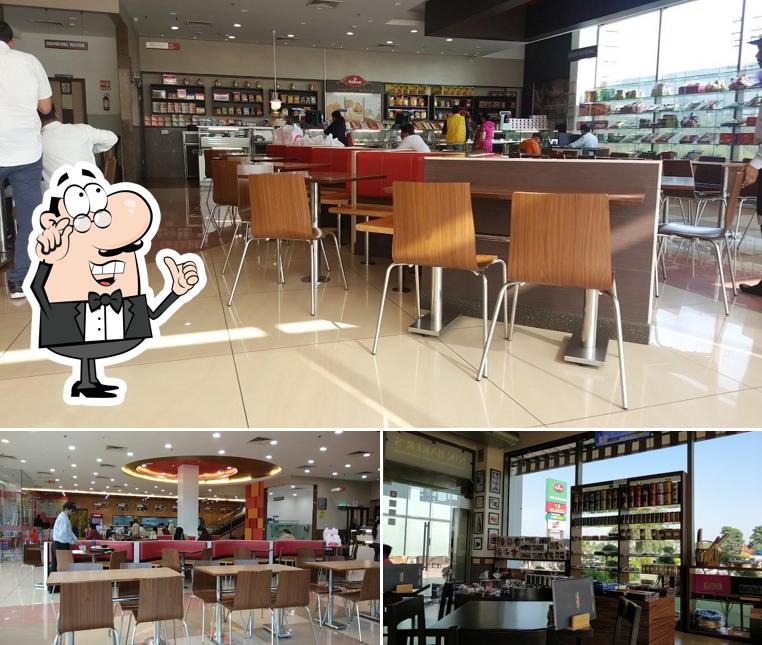 Take a seat at one of the tables at Haldiram's - Zirakpur Take a seat at one of the tables at Haldiram's - Zirakpur