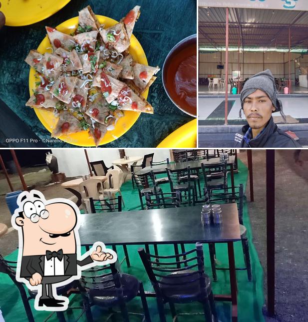 Take a seat at one of the tables at श्री शंकर कृपा फैमली रेस्टोरेंट