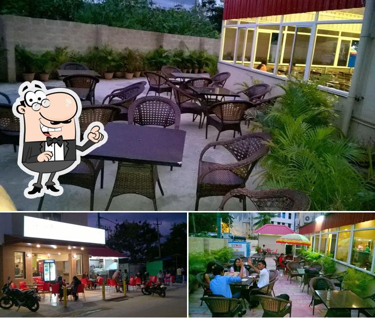Take a seat at one of the tables at Sitara Veg Restaurant