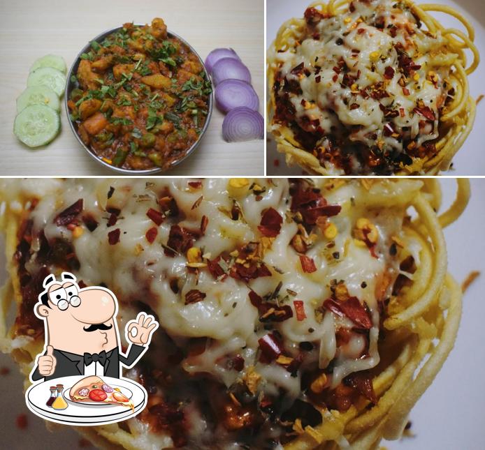 Get pizza at Devi Restaurant