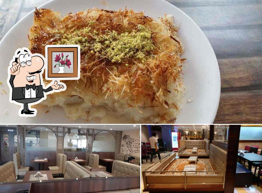 Check out the image displaying interior and food at Mandi@36