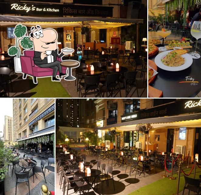 Take a seat at one of the tables at Rickys Bar & Kitchen