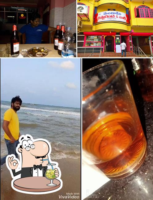 The photo of drink and exterior at Mandhakini Bar And Restaurant