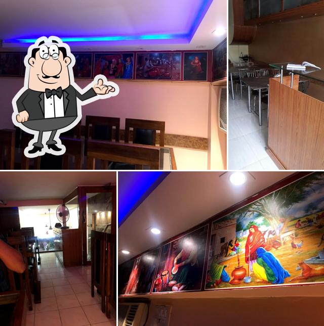 Take a seat at one of the tables at Nirmal's The Punjabi Dhaba