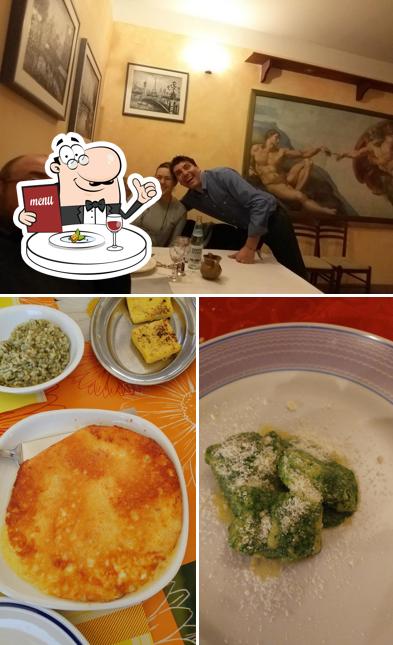 Questa è la foto che presenta la cibo e tavolo da pranzo di Osteria La' Di Berto