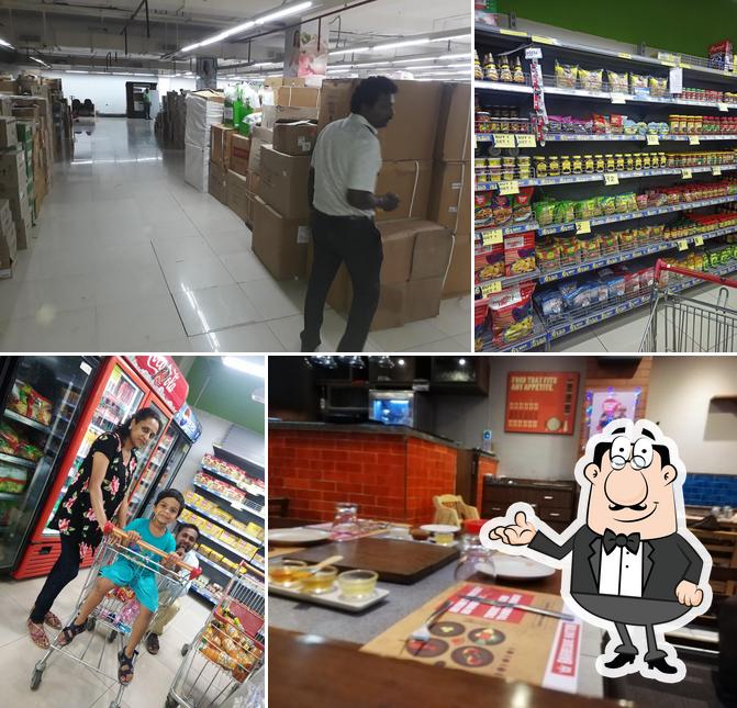 Take a seat at one of the tables at Manghalam Towers