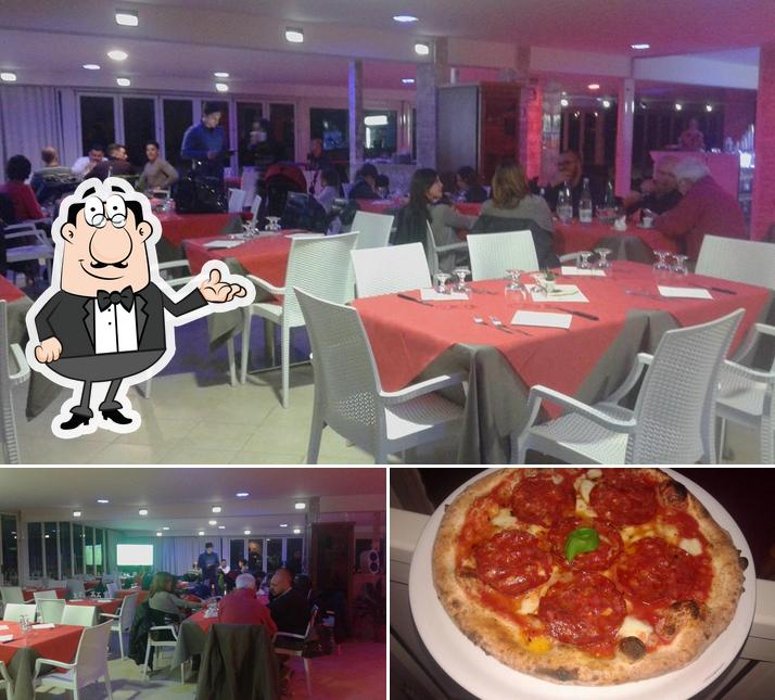 Questa è la foto che mostra la interni e pizza di Lido Luna Rossa