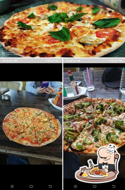 Get pizza at Om Shiva Garden Restaurant